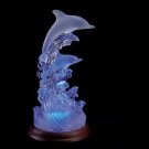 DOLPHINS ON WAVES OF LIGHT