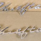 1958 Pontiac Chieftain NOS door & panel emblem pair
