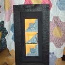 Blue and Yellow Log cabin quilt framed stitchery