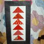 Red flying geese quilt framed stitchery