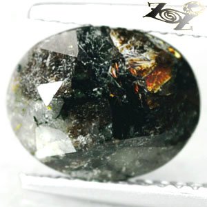 3.84 CT.Natural Oval 8*10 mm. Spark Orange Plates Matrix Gray Black Astrophylite