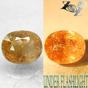 6.69 CT.Natural Oval 10*12 mm. Intense Salmon Yellow Color Shift Ferro Axinite
