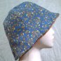 NEW~HANDMADE REVERSIBLE HAT~ORANGE-TAN/BLUE FLORAL DESIGN