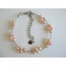 TB602  Peach Freshwater Pearls White Pearls 3 Stranded Wire Bracelet