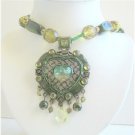 N491  Green Multi Stranded Necklace Holding Traditional Heart Pendant w/ Dangling Beads Necklace