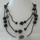 N571  Black Pearls Three Stranded Beaded Necklace Simulated Pearls Millefiori Painted Beads