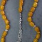 PRAYER BEADS KOMBOLOI ROUND BARREL HONEY AMBER