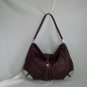 Wine Hobo Leather Handbag with metalic details.