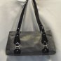 Gray leather with black patent leather details and buckles
