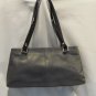 Gray leather with black patent leather details and buckles