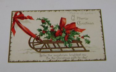 Vintage Postcard " A Merry Christmas" Misletoe on Sled