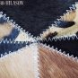 622 COWHIDE HAIR-ON LEATHER PATCHWORK RUG 48IN DIA
