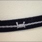 JUSTIN FENCED IN BLACK LEATHER HAT BAND W/ STRING OVERLAY SILVER BUCKLE