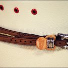 JUSTIN FENCED IN TAN LEATHER HAT BAND W/ TWISTED OVERLAY SILVER BUCKLE