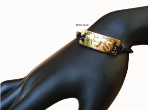 Gold plate ALAD on black cord bracelet
