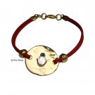 A sparkling Hamsa on red cord bracelet
