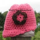 pink brimmed flower hat with brown flower