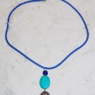 Artisan Turquoise drop pendant with blue braided neck cord