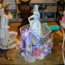 Lady in a cup centerpiece