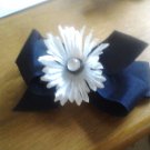 Navy blue hair bow with white flower and faux diamond