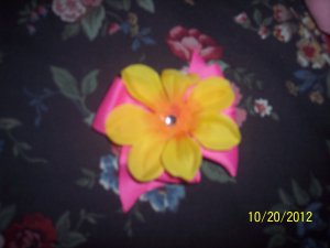 pink bow with beautiful yellow flower