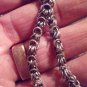 Tibetan Silver Repousse Buddhist Pendant with Turquoise and Coral