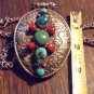 Tibetan Silver Repousse Buddhist Pendant with Turquoise and Coral