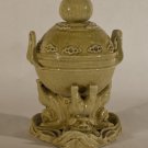 Chinese antique porcelain oil lamp with foo dogs holding the vessel