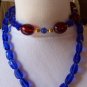 Vintage MONET Blue and Cherry Red Lucite Bead Necklace