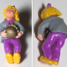 VINTAGE CHARACTER RUBBER PLASTIC PENDANT GIRL CARRYING