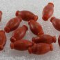 Vintage set of 12 Plastic Orange White Barrel Beads