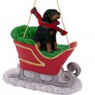 SLD127 Black & Tan Coonhound Sleigh Ride Ornament