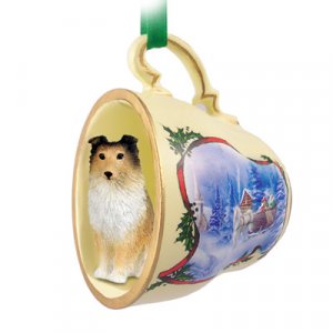 STCD20A Sheltie, Sable Sleigh Ride Holiday Tea Cup Ornament