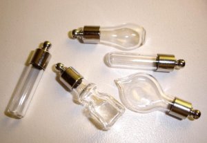 5 assorted glass vials with screw top resealable caps