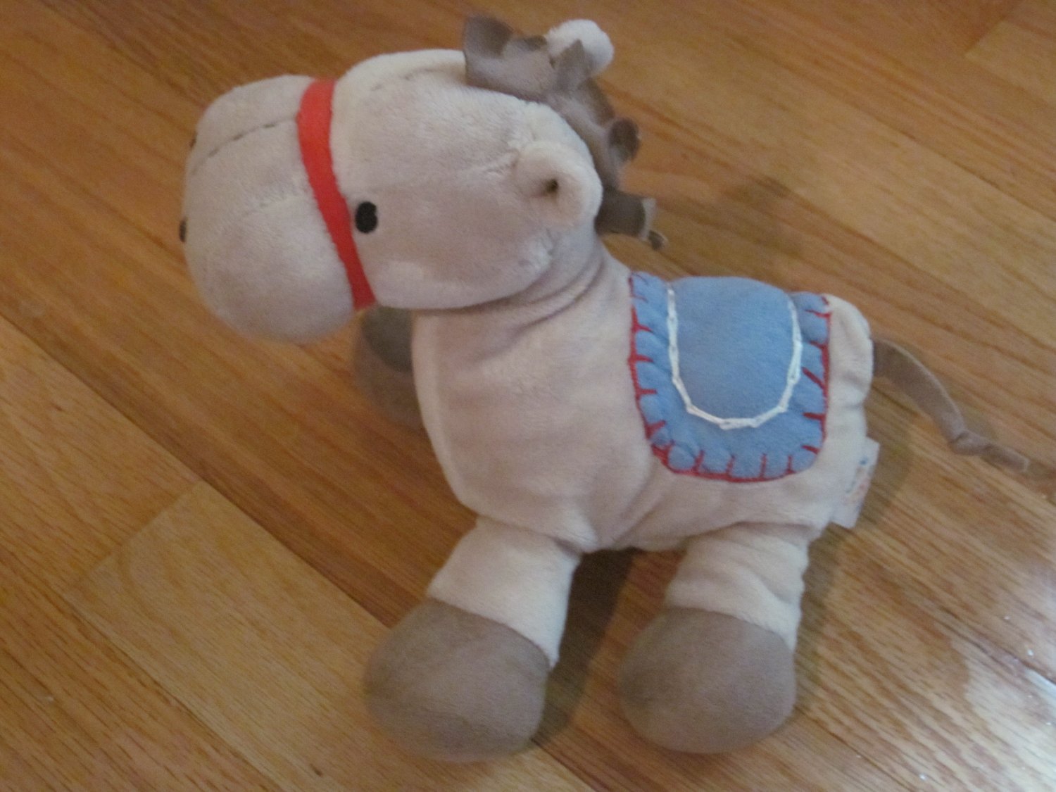 giant plush horse with saddle