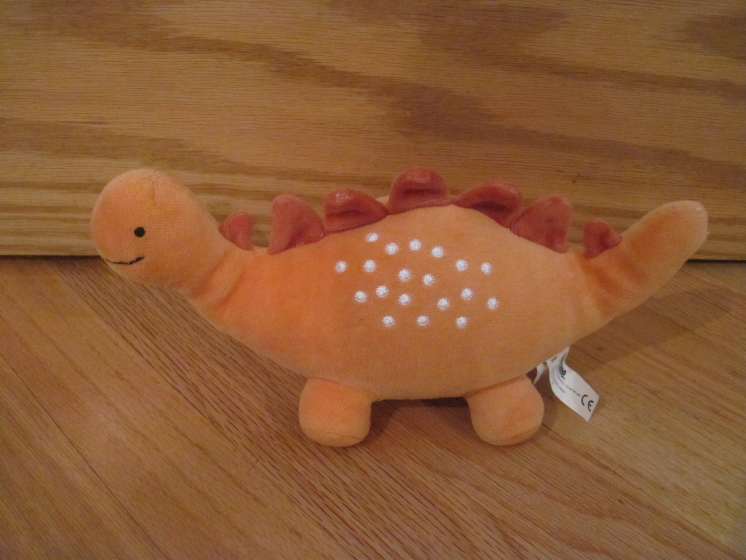 orange dinosaur plush