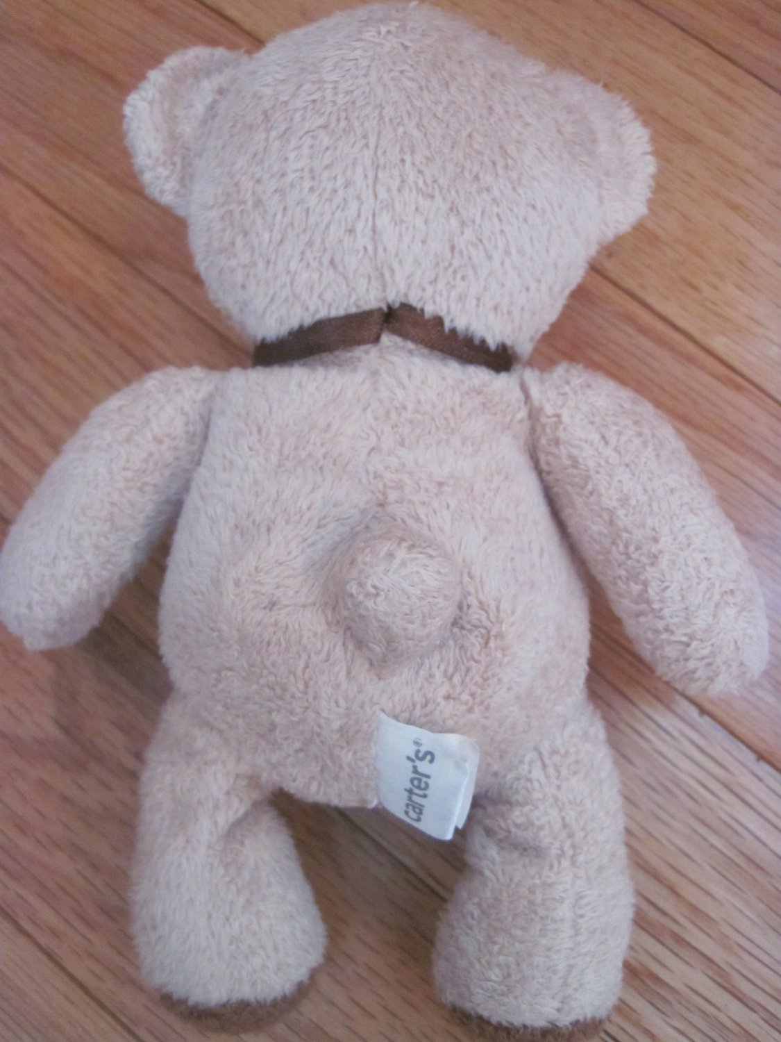 teddy bear with stitched eyes