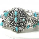 Turquoise stone deco fleur de lis stretch bracelet