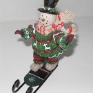 Snowman Wearing Top Hat Ornament on Sled     M2a