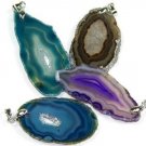 Assorted size extra quality agate slice pendants with bail. Sold in 25 piece bag.