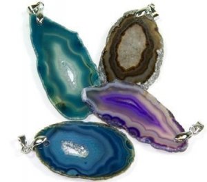 Assorted size extra quality agate slice pendants with bail. Sold in 25 piece bag.