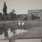 VELOX postcard 1907-1917 big barn 2 women at a pond