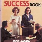 THE WOMAN'S DRESS FOR SUCCESS BOOK