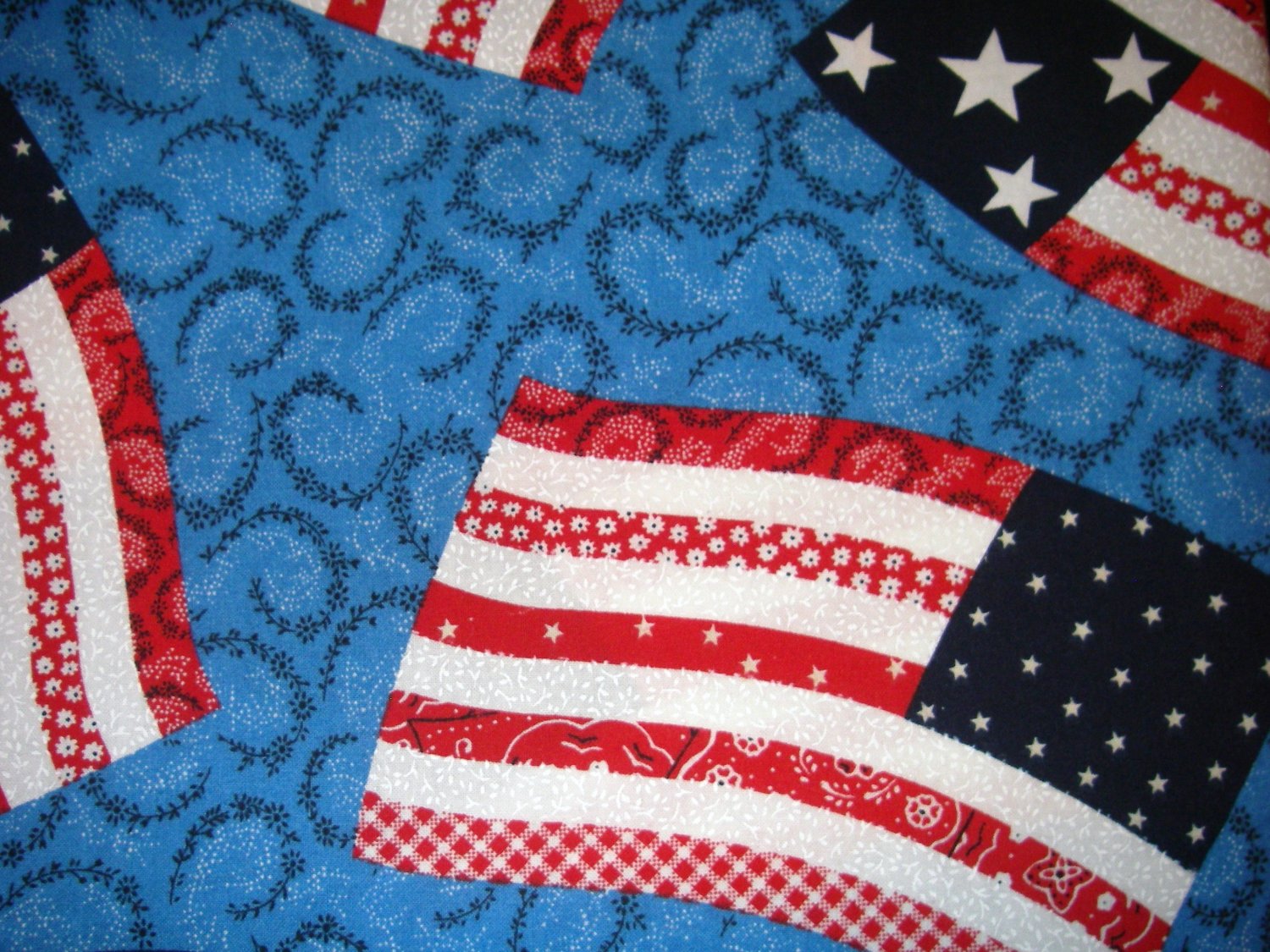 1 yard - Large flags on bright blue fabric