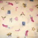1.875 yards - Cream colored background with small holiday items all over fabric