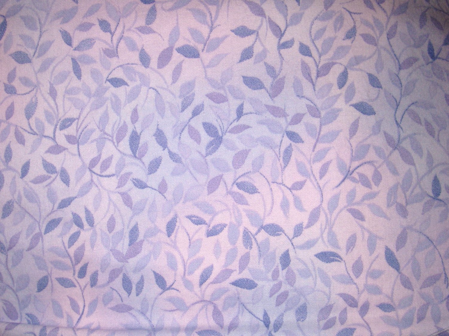 1.33 yards - Purple leaves all over lavendar fabric