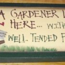 Wooden Sign Gardener Lives Here with Her Well Tended Family