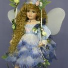 Fairy doll on swing wearing Blue