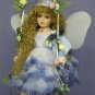 Fairy doll on swing wearing Blue