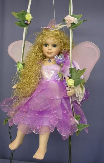 fairy on a swing figurine